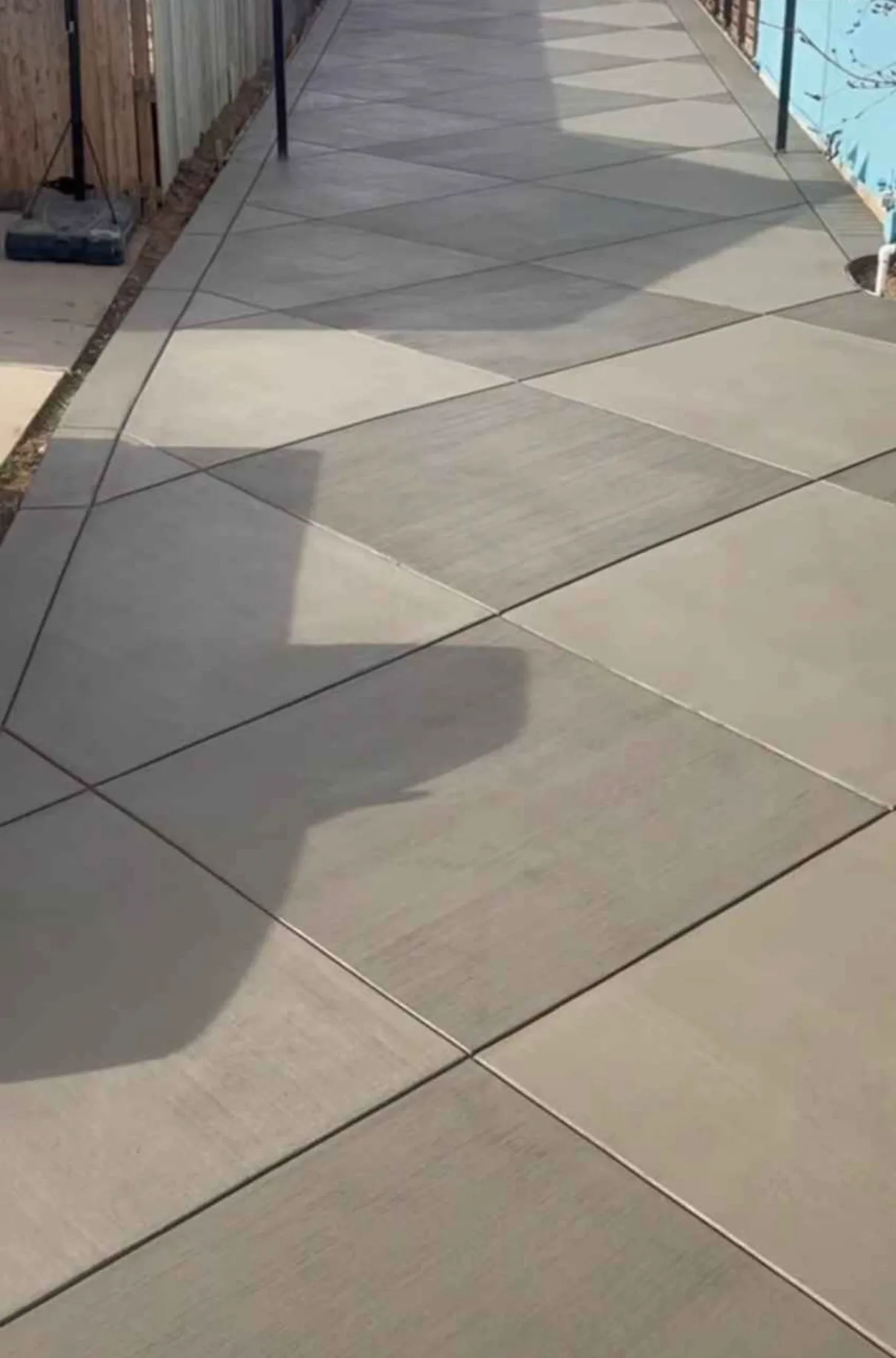 Large jointed concrete patio slab with a smooth finish