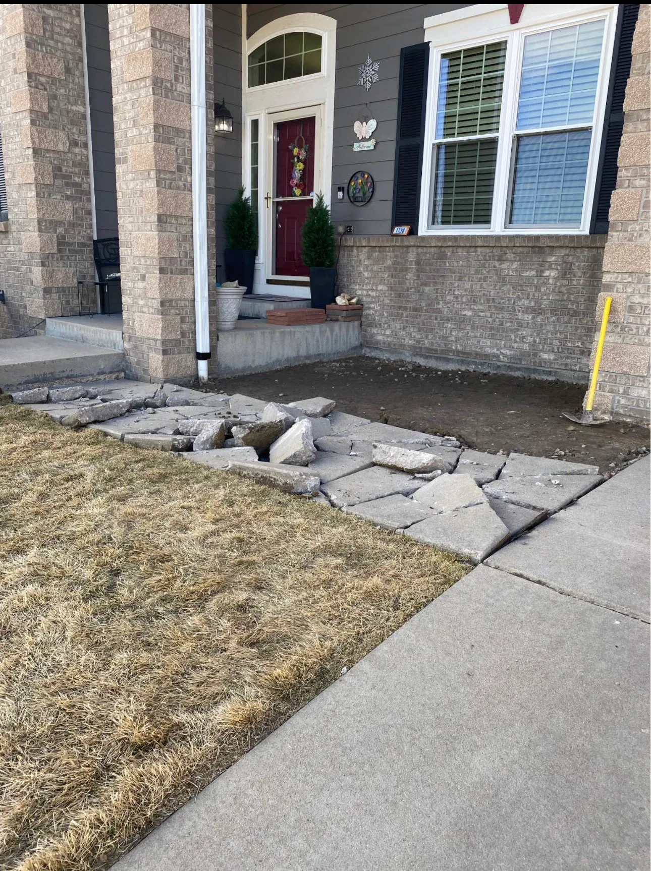Front walkway with flagstone and river rock beds either side
