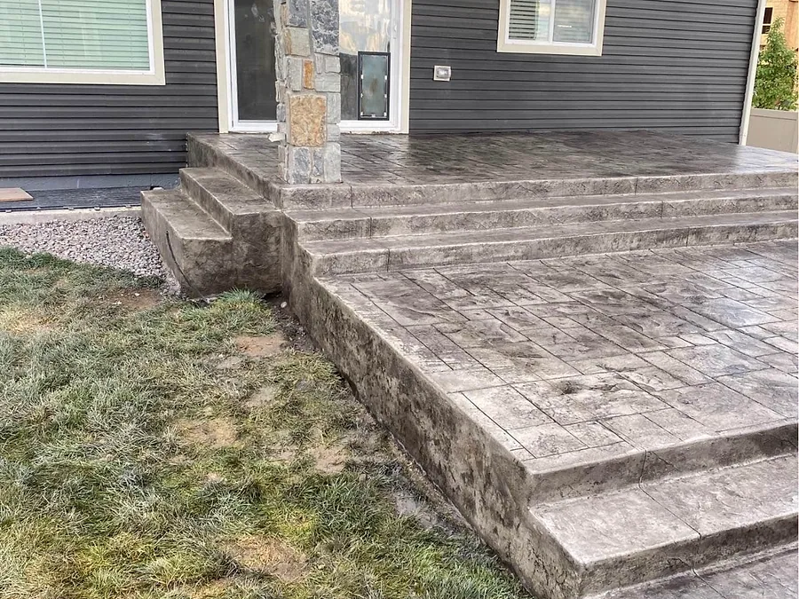 Stamped concrete steps and landing at the front of a house