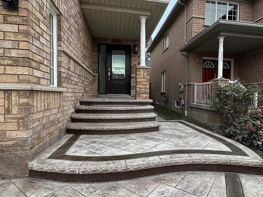 Stamped concrete front steps and path at a brick fronted home
